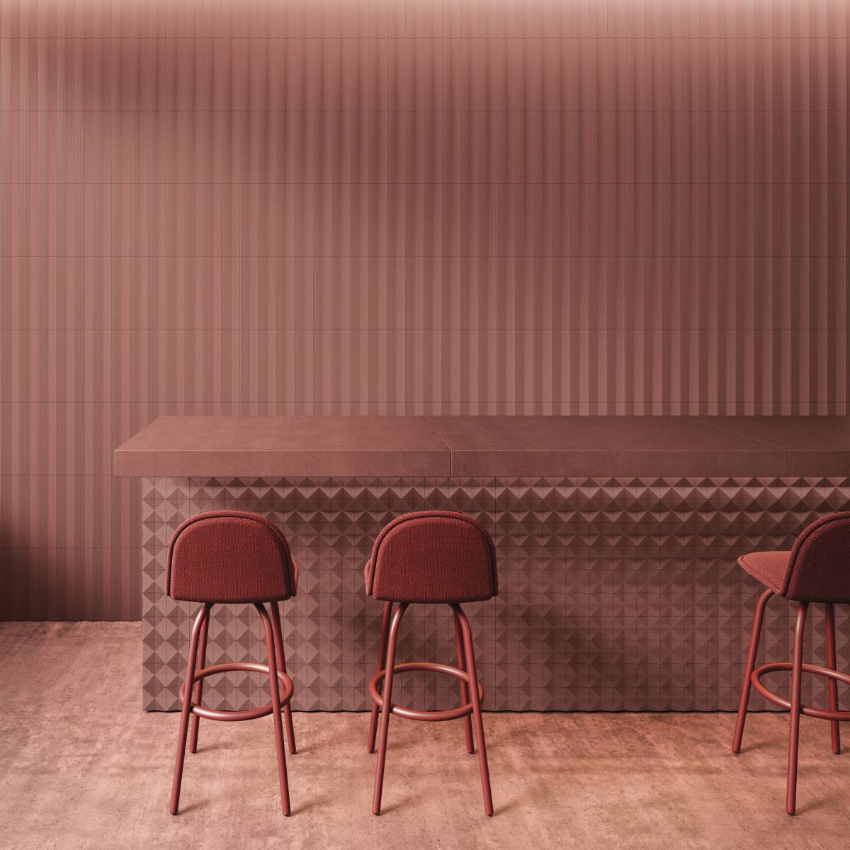 Bar wyłożony czerwonymi płytkami z efektem trójwymiarowości z ladą i trzema krzesełkami