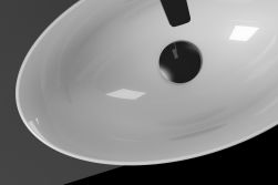 Widok z góry na białą, owalną umywalkę nablatową Eto Pit z korkiem w chromie
