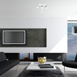 Nowoczesny salon z białym stolikiem, czarną kanapą i fotelem, telewizorem na ścianie i białą lampą sufitową Joker White