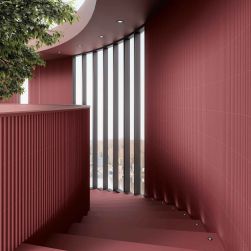Korytarz ze schodami wyłożony czerwonymi cegiełkami ściennymi 3D Stripes Garnet Matt
