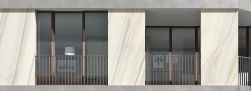 Elewacja domu wyłożona płytkami imitującymi marmur Marmi Maxfine Bianco Lasa