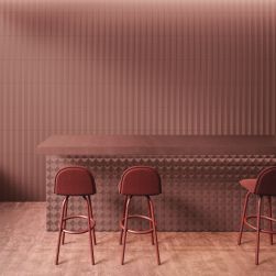Bar utrzymany w czerwieni z blatem i trzema krzesłami oraz płytkami z kolekcji Pique
