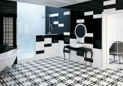 Czarno-biała łazienka z podłogą wyłożoną patchworkowymi płytkami House of Vanity HV-1, z białą wanną z ozdobnymi nogami, czarną ławą z umywalką nablatową i okrągłym lustrem oraz prysznicem