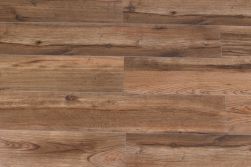 Podłoga ułożona z brązowych płytek drewnopodobnych Mumble-C 19,5x121,5