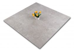 Kompozycja czterech szarych płytek imitujących beton z ozdobnym kwiatem At.Edge Ceniza 60x60