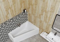 Mała łazienka wyłożona płytkami szarymi oraz drewnopodobnymi z białą wanną narożną Furdo i białą półką wiszącą z umywalką nablatową i lustrem w czarnej ramie