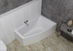 Łazienka z szarą, betonową ścianą i jasną podłogą, białą wanną narożną Tilo i baterią podtynkową oraz betonowym blatem