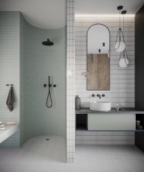 Łazienka ze ścianami przy umywalce wyłożonymi białą mozaiką Mr. Twig Camden, z wiszącą szafką z umywalką nablatową okrągłą, lustrem, lampą wiszącą i półokrągłą kabiną prysznicową