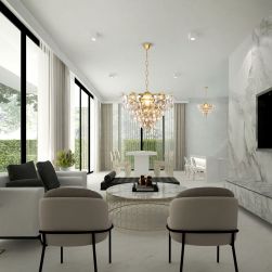 Przestronny salon z fotelami, krzesłami, stołami, telewizorem na ścianie i eleganckim żyrandolem Sellena gold 6xE14 Milagro