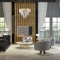 Luksusowy salon z czarną, skórzaną kanapą, dwoma szarymi fotelami, okrągłym stolikiem, złotymi zdobieniami oraz eleganckim żyrandolem Chelsea gold 6xE14 Milagro