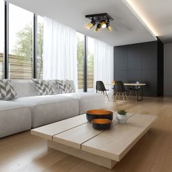Grafitowy salon z białą kanapą, drewnianym stolikiem i czarną lampą sufitową
