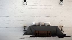 Biała sypialnia z szarym łóżkiem, dwoma stolikami nocnymi i dwoma czarnymi lampami sufitowymi