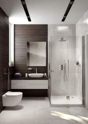 Nowoczesna, mała łazienka z wiszącą miską WC i zestawem bidetowym podtynkowym Deante Alpinia, z kabiną prysznicową, wiszącą szafką z umywalką nablatową i lustrem