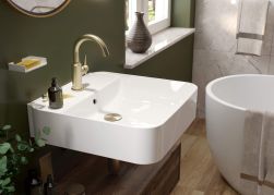 Łazienka, biała umywalka, ściany w kolorze zieleni, na umywalce akcesoria łazienkowe oraz Temisto Bateria umywalkowa mosiądz BQT_M21M
