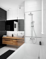 Nowoczesna łazienka z białą wanną, zestawem wannowym z baterią, słuchawką i deszczownicą Deante Coriander w chromie, z wiszącą szafką drewnianą, białą umywalkową nablatową i dużym lustrem