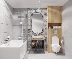 Szara łazienka z białą wanną, zestawem prysznicowym Deante Alpinia, miską WC, wiszącą półką z umywalką i owalnym lustrem