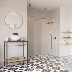 Łazienka z kabiną prysznicową we wnęce i ścianką prysznicową Walk In Fix z czarnymi profilami, czarnym zestawem prysznicowym, stolikiem z białą umywalką nablatową i okrągłym lustrem
