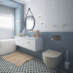 Niebieska łazienka z beżową miską WC wiszącą oraz przyciskiem spłukującym w chromie Dero, błękitną szafką wiszącą z umywalką nablatową, okrągłym lustrem i białą wanną wolnostojącą