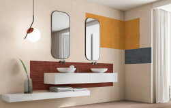 Łazienka, biały blat, na blacie dwie umywalki, na ścianie dwa lustra, na ścianie nad umywalką bordowe płytki, w rogu jako element dekoracyjny płytki Carpi Navy 20x50 płytka imitująca beton