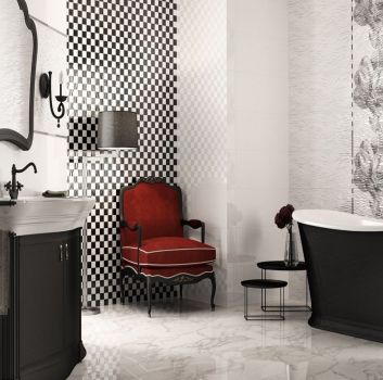 Biało-czarna łazienka z czarną wanną wolnostojącą, czerwonymi siedziskami oraz wbudowaną w brązową szafkę umywalką